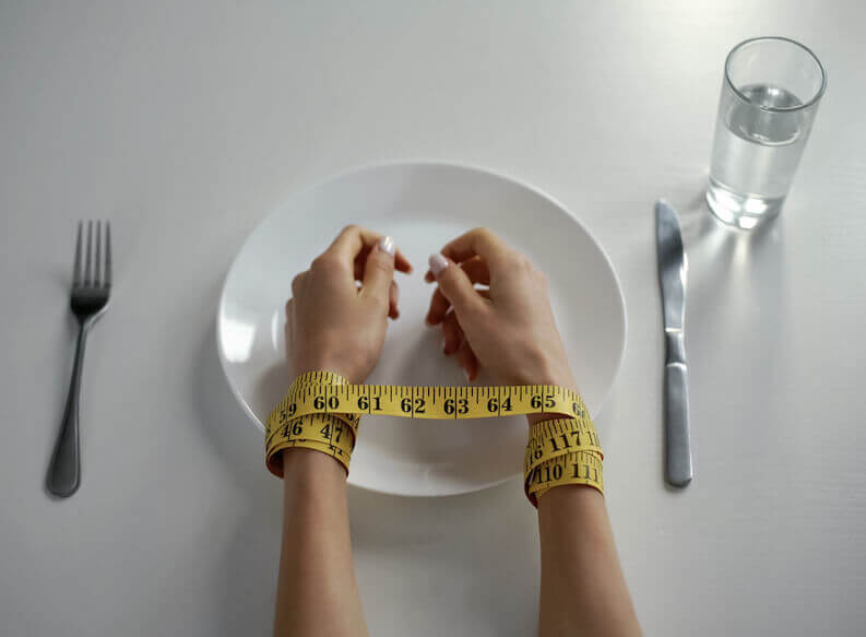 hands tied by eating disorder